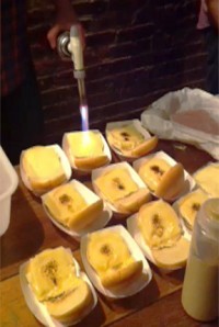 mortadell Must-have kitchen utensil: A blowtorch helped create beer companion foods like sandwiches with melted cheese, Meat Hook-made mortadella, pickled onion and a spritz of mustard.