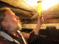 Lenz winemaker Eric Fry examines some of his coveted cuvee. The winery launches a farmers market on April 23.