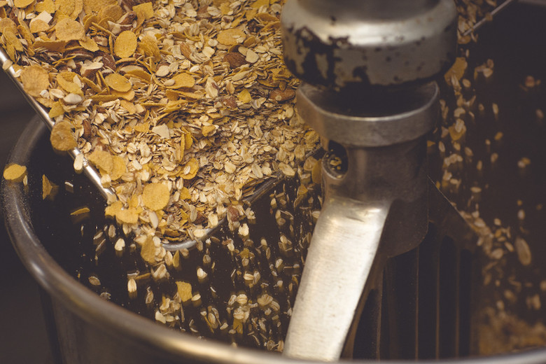 Mixing up a batch of granola. Photo credit/Small Batch Granola.