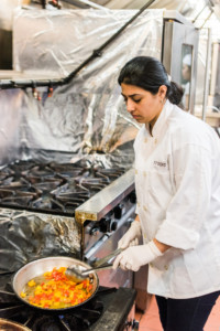 Eat Offbeat - Dhuha frying peppers for rice.