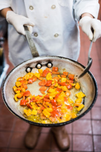 Eat Offbeat - frying peppers fto be added to rice.