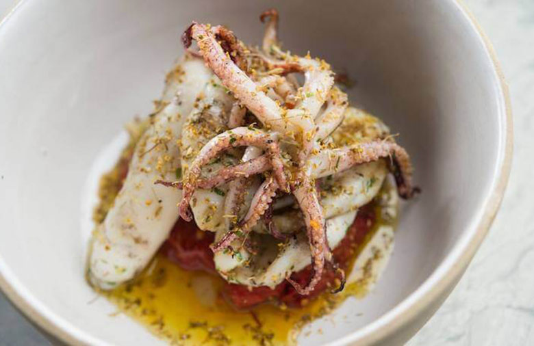 white bowl containing italian calamari dish from lilia ristorante