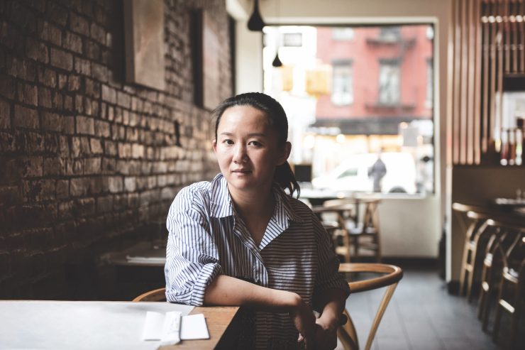 Simone Tong sits at a table at her restaurant, Silver Apricot.