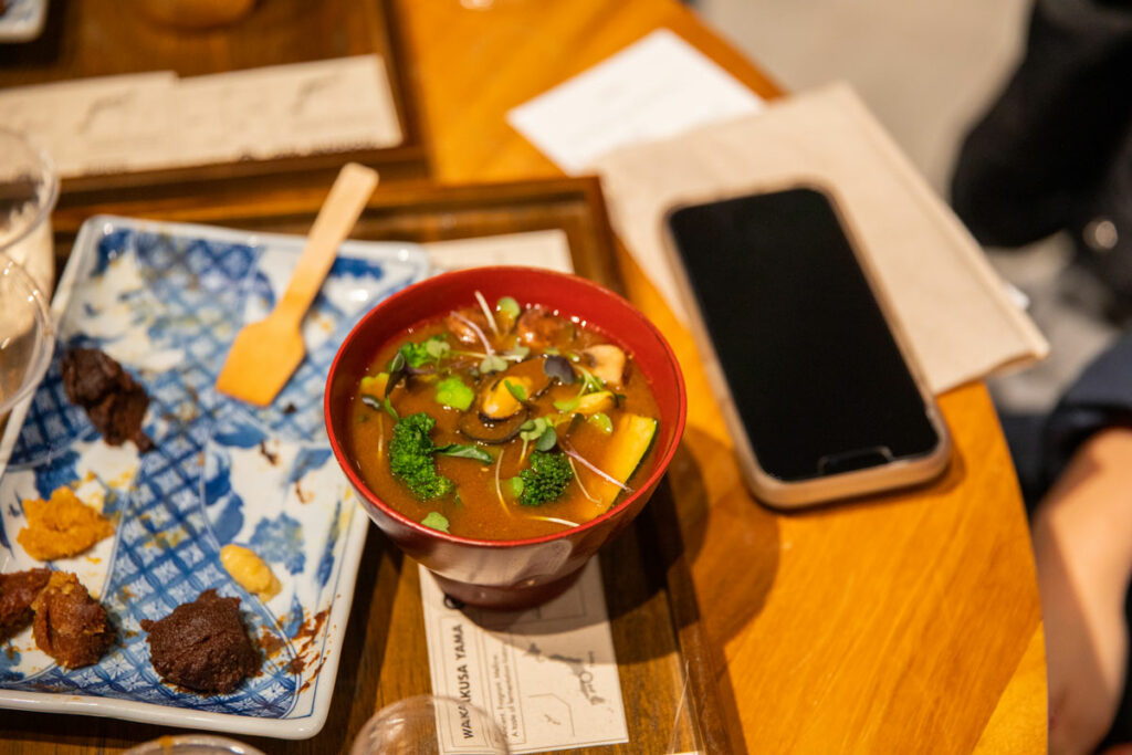 bowl of miso soup with miso tastings on side