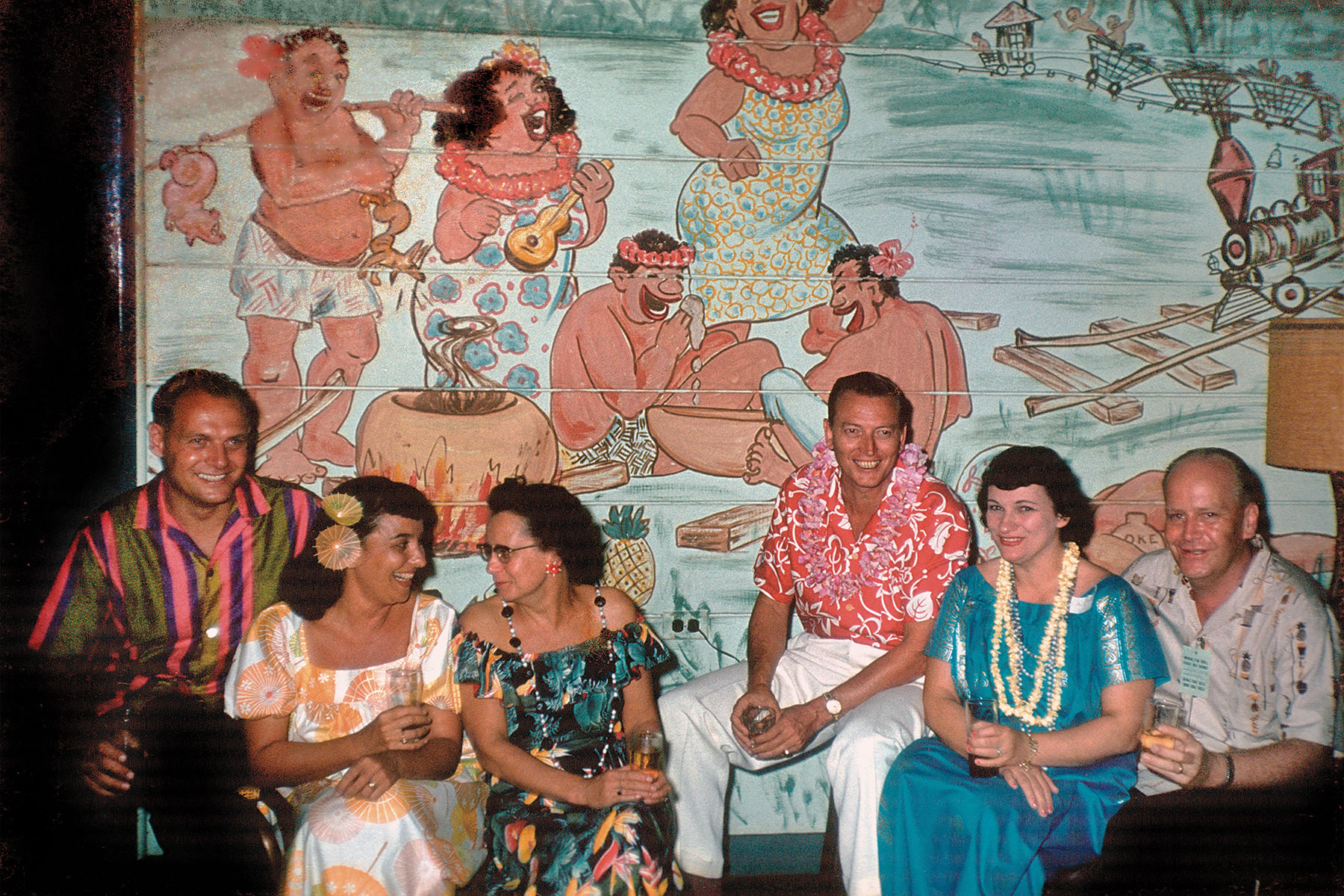 retro photo of vacationers in a tiki setting