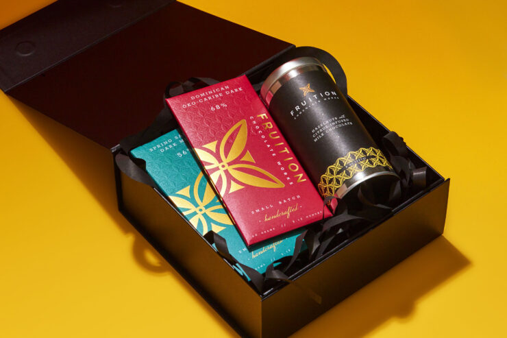 a fruition chocolate gift box pictured against a gold background