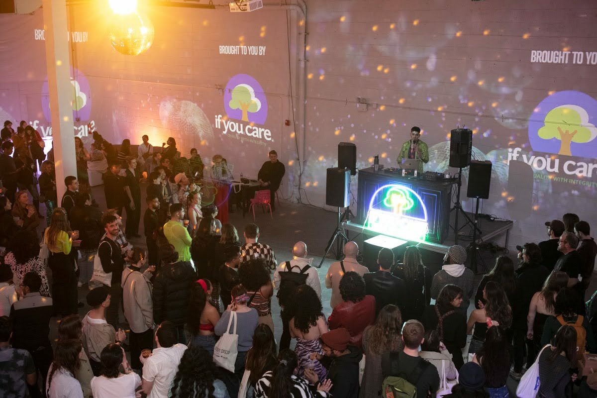 a crowd gathers at a disco themed party